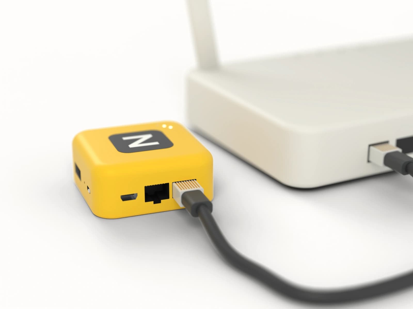 The back of the Puck, with its two network ports plugged into a home router.
